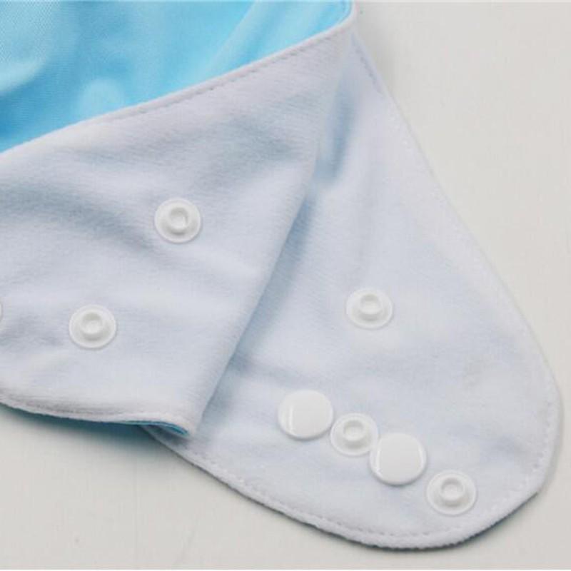 A closer look to the buttons on the side wings of the adult diapers. It shows several buttons close together which gives it adjustable sizing.